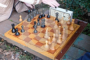 Two men play chess.