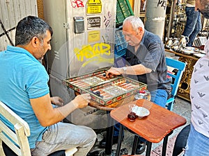 Two Men Playing Backgammon