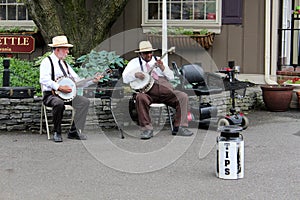 Two men playing banjos for entertainment,Intercourse,Pennsylvania,May,2013