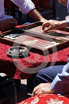 Two men playing a game of backgammon (tavla) in a teahouse in Istanbul, Turkey
