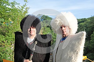 Two men posing in national Adyghe clothes in Khadzhokh gorge