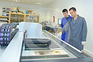 Two men in professional printing works