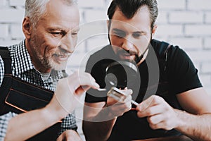 Two Men Repairing Hardware Equipment from PC.