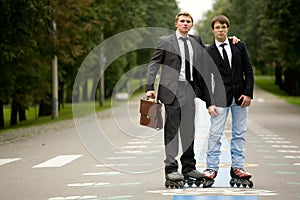 Two Men On The Road With Rollerblades photo