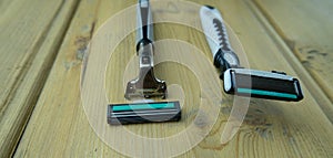 Two men`s razors with replaceable cartridges are on the table