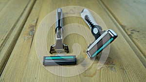 Two men`s razors with replaceable cartridges are on the table
