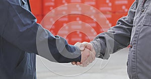 Two men shake hands. Handshake of two men close-up. Factory shaking hands, concluding a successful deal