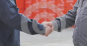 Two men shake hands. Handshake of two men close-up. Factory shaking hands, concluding a successful deal