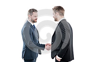 two men shaking hands. businessmen on meeting. boss and employee. partners after business deal.