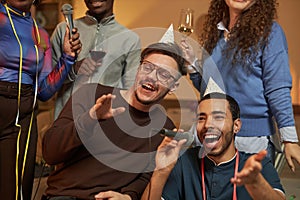 Two Men Singing Karaoke Together