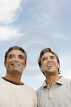 Two men smiling