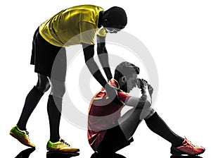 Two men soccer player fair play concept silhouette