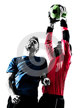 two men soccer player goalkeeper catching heading ball competition silhouette