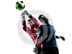two men soccer player goalkeeper punching heading ball competition silhouette