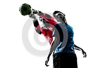 two men soccer player goalkeeper punching heading ball competition silhouette