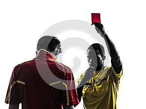 Two men soccer player and referee showing red card silhouette