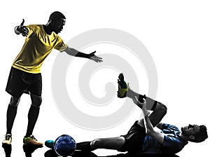 Two men soccer player standing complaining foul silhouette