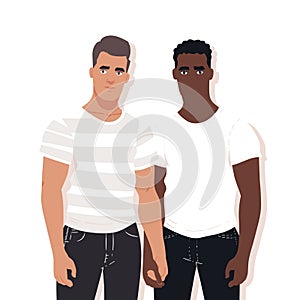 Two men standing together, one Caucasian one African, wearing casual white tshirts jeans photo