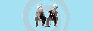 Two men in a suit with antique statue bust sitting on chair and talking. Contemporary art collage. Friends and team