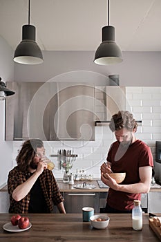 Two men talking in the kitchen