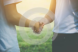 Two men volunteer handshake for congratulate each other