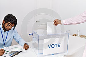 Two men voting at electoral college