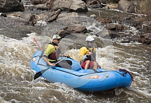 Two men whitewater rafting on the popular Poudre River in Colorado on the Poudre River, Colorado, USA, 8 May