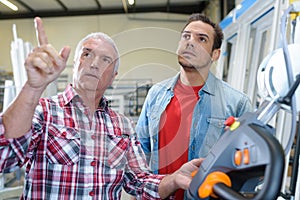 two men in window manufacturing factory