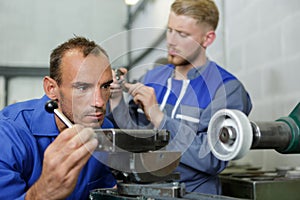 two men working in engineering workshop