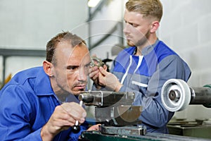 two men working in engineering workshop