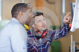 two men working at factory