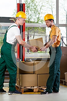 Two men working together at warehouse