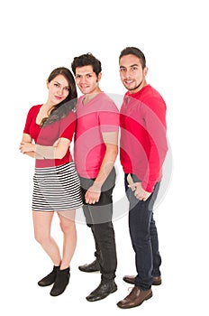 Two men and a young girl dressed in red posing