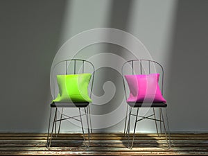 Two metal chairs with green and pink cushions