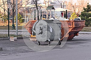 Two metal garbage cans. unsorted garbage. Outdoor.