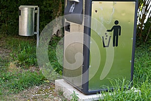Two metal litter bins in public spaces.