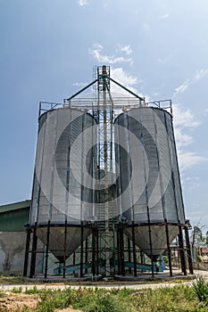 Two metal silo