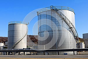 Two Metallic Round Chemical Storage Tanks