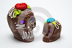 Two Mexican Calaverita de azucar Candy Skull and Calaverita de Chocolate,