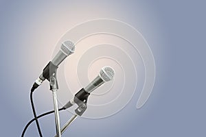 Two microphone blue background