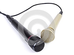 Two microphones with a cord isolated on a white