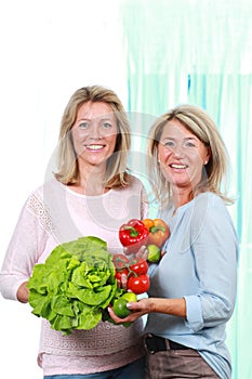 Two middle age woman with healthy food