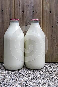 Two Milk Bottles on a Doorstep