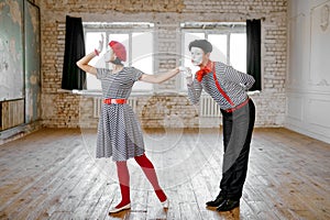 Two mime artists, love couple parody scene