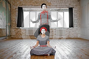 Two mime artists, love couple parody scene