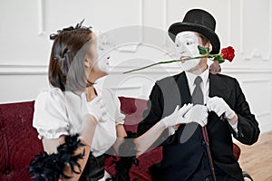 Two mime artists, love couple, scene with rose