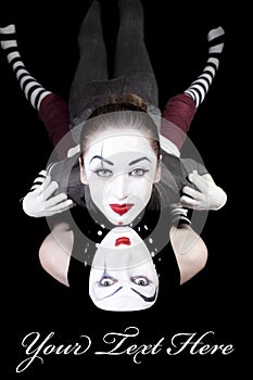 Two mimes on black background