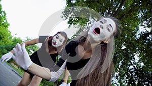 Two mimes girls imitate flirt on camera