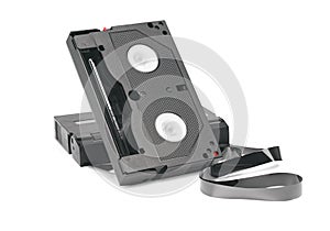 Two mini videotapes with unwound magnetic tape isolated on white