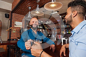 Two Mix Race Man In Bar Clink Glasses Toasting, Drinking Beer Hold Mugs, Cheerful Friends Meeting